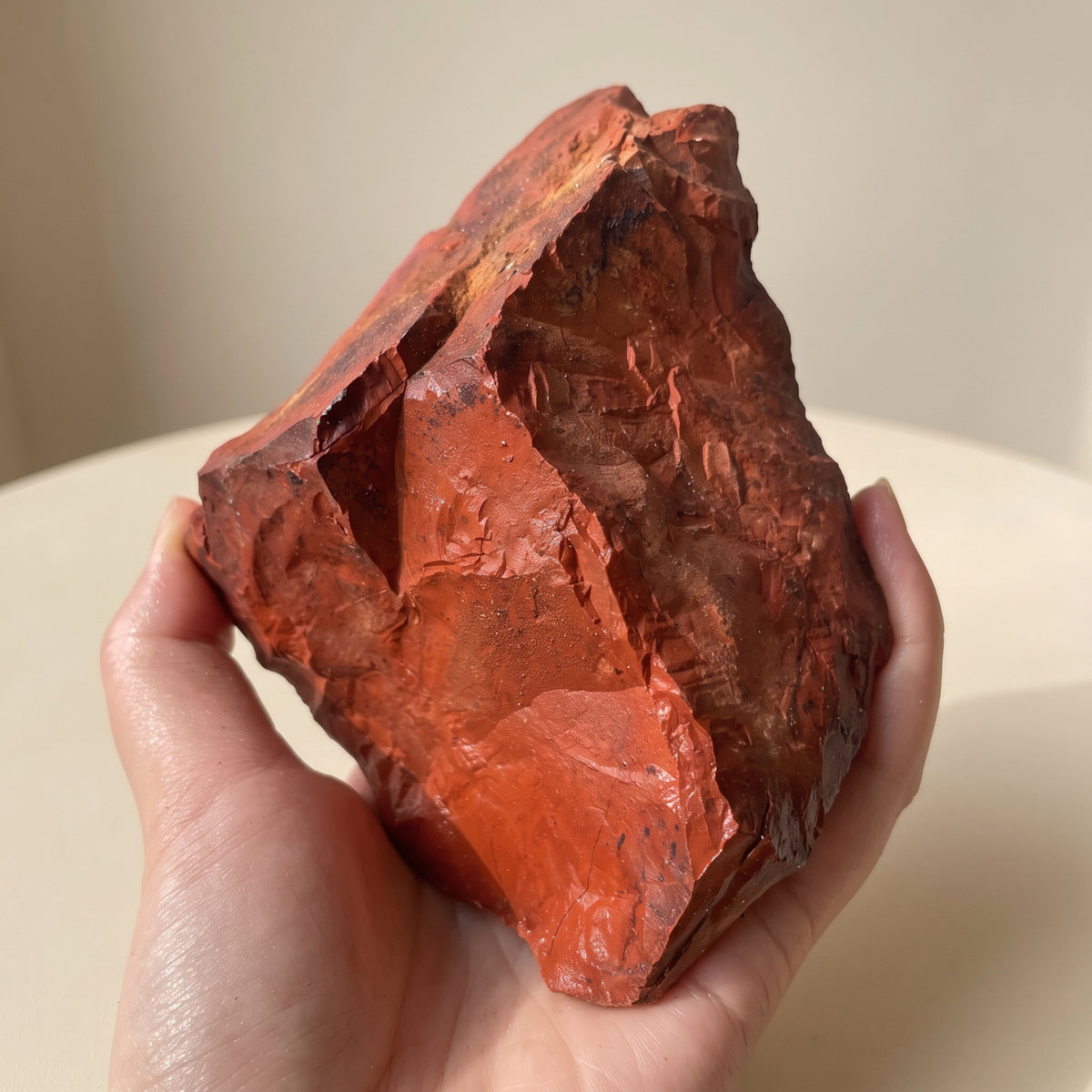 Real photo of a raw red jasper chunk; each piece is unique