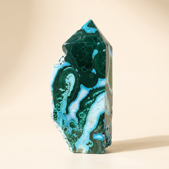Malachite and chrysocolla freeform tower, green with sky-blue patches