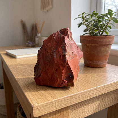 Red jasper on an oak console table