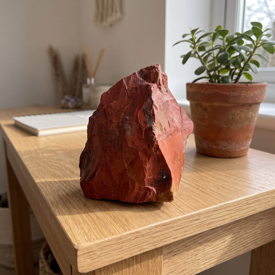 Red jasper on an oak console table