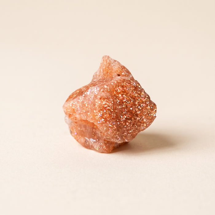Raw sunstone with coppery glitter