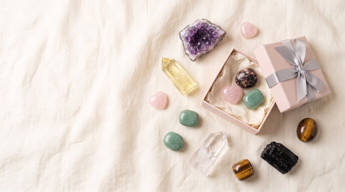 Stones and Rockz pink gift box with amethyst, citrine, clear quartz, rose quartz hearts, aventurine, tiger's eye and black tourmaline on ivory linen