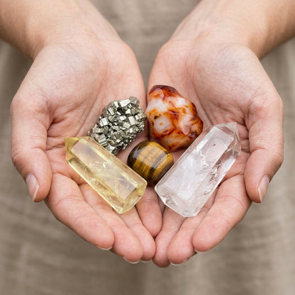 The Ambition Altar stones held in cupped hands to show size