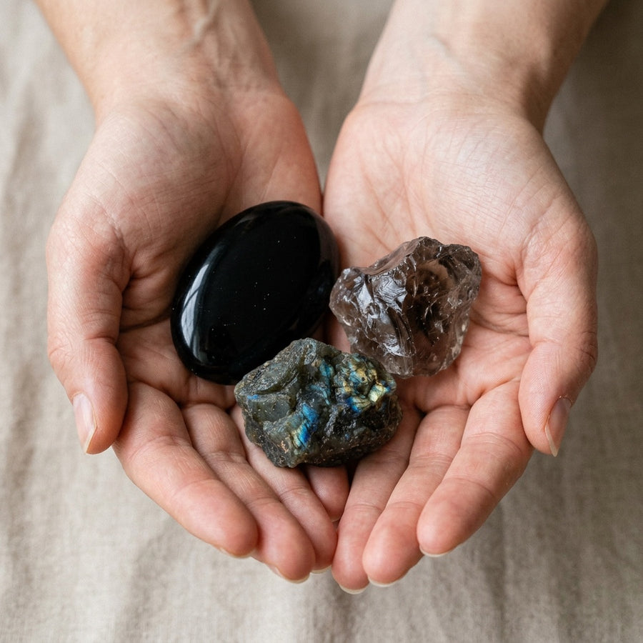 The Boundary Builder stones held in cupped hands to show size