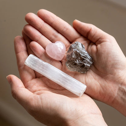 The Grief Companion stones held in cupped hands to show size