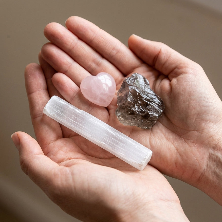 The Grief Companion stones held in cupped hands to show size