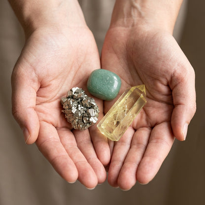 The Good Luck Ritual stones held in cupped hands to show size